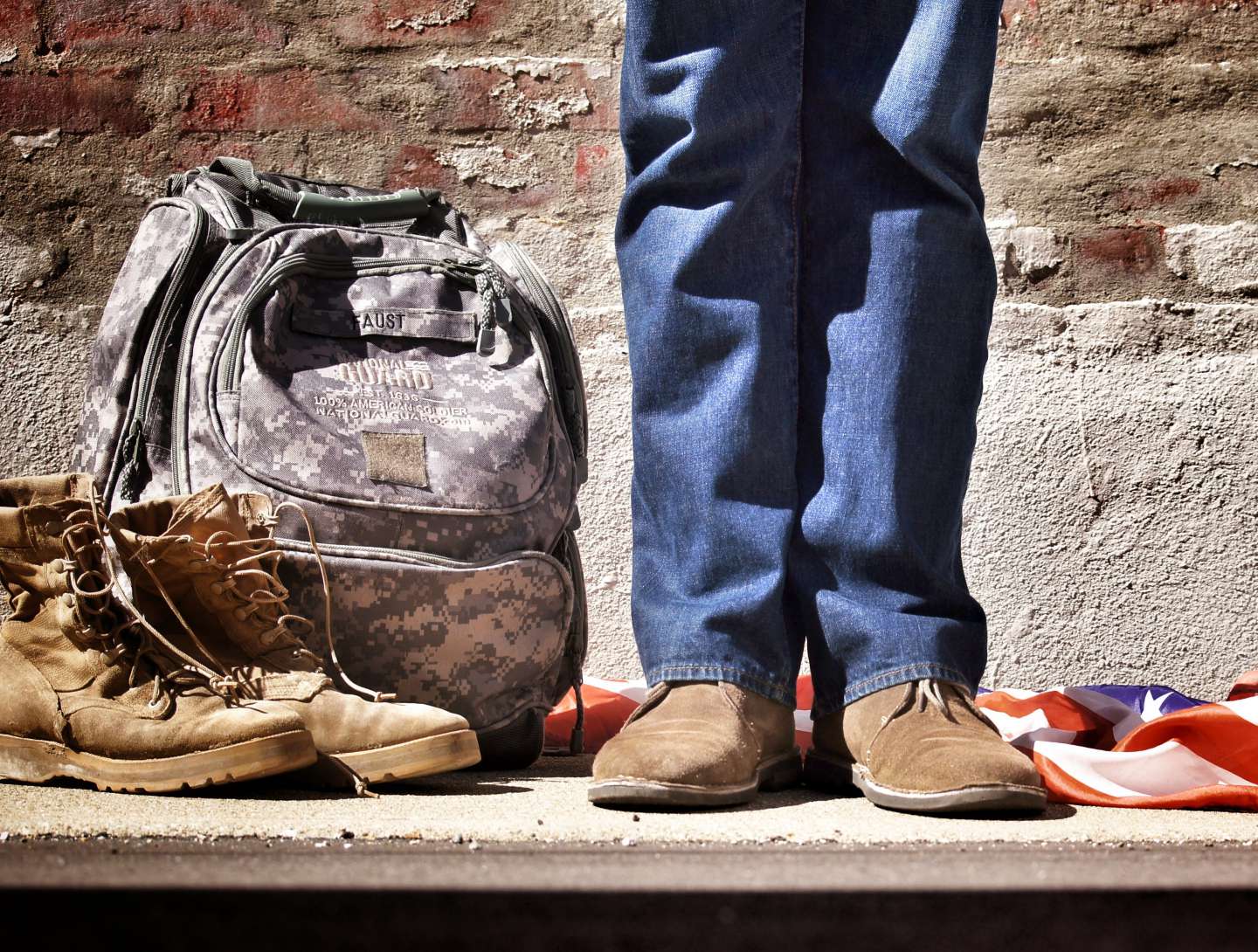 Military bag, boots, and American flag