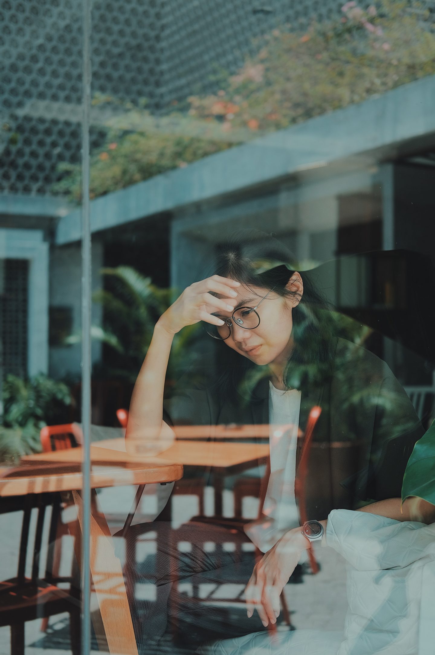 Woman sitting depressed at table